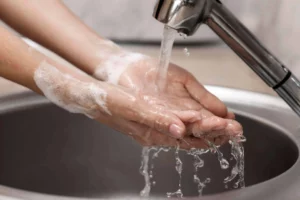 Water Treatment Process Optimisation Benefits: Person Washing Their Hands With Clean Water